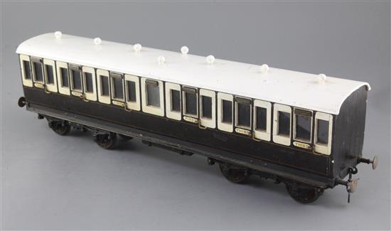 A Gauge 1 non-corridor coach, chocolate and cream coloured, 50cm long with auto coupling